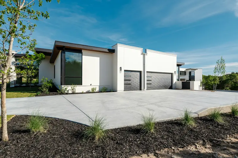 New concrete driveway in front of a suburban home, the kind of project common in Edmond
